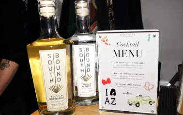 Southbound Tequila Reposado and Blanco bottles displayed next to a custom cocktail menu at an Alice + Olivia event by The Bond Bar in Scottsdale, Arizona.