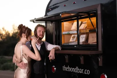 couple at cigar window of the bond bar
