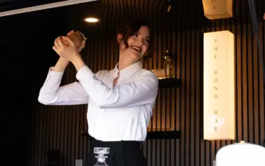 Professional bartender crafting a handcrafted cocktail at The Bond Bar luxury mobile cocktail bar in Scottsdale, Arizona.
